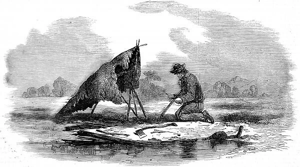 Canadian guide making a canoe, 1858