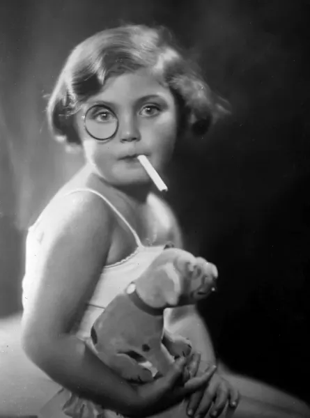 Framed Print of Early 1930s Print of a Young Girl Smoking a Cigarette.  Framed Print from Mary Evans