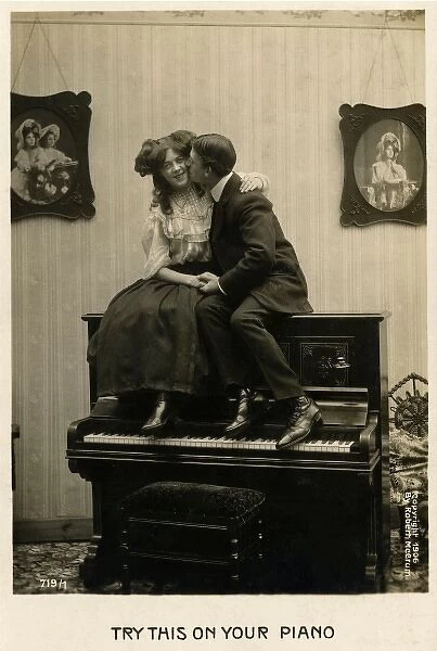 Couple canoodling on a piano