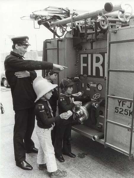 Cub Scouts cleaning fire engine