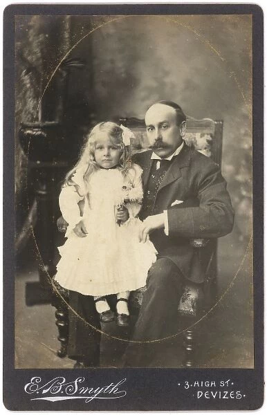 Edwardian man with a little girl in a white dress