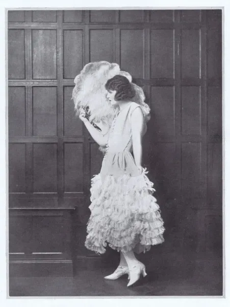 Framed Print of 1923 Fashion Print: Ostrich Feathered Dance Frock. Framed  Print from Mary Evans