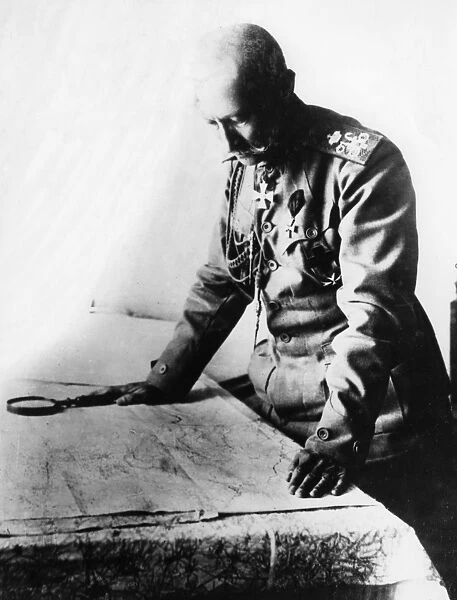 German army officer examining a map, WW1