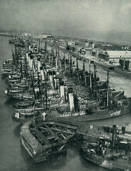 Grimsby Harbour. A view of deep-sea fishing boats lined up alongside Grimsby Quay Date