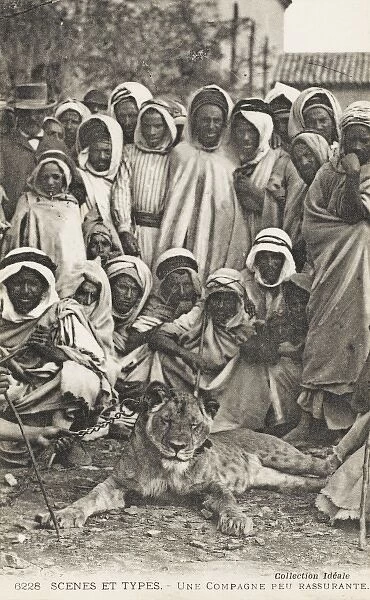 Group of Algerian men and tame Lion