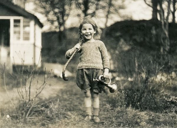 Little girl with walking stick and toy bugle, Scotland