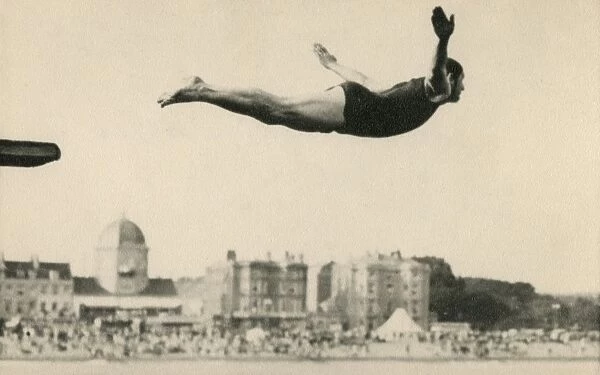 Man diving at a seaside resort