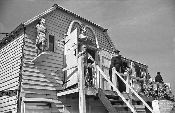 Men at coastal storage hut
