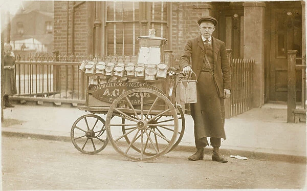 Milk boy with three-wheeled cart & cans
