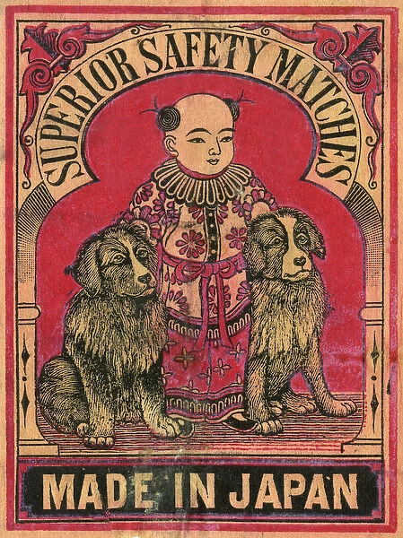 Old Japanese Matchbox label with a boy and two dogs