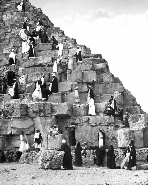 People climbing the Great Pyramid, Egypt