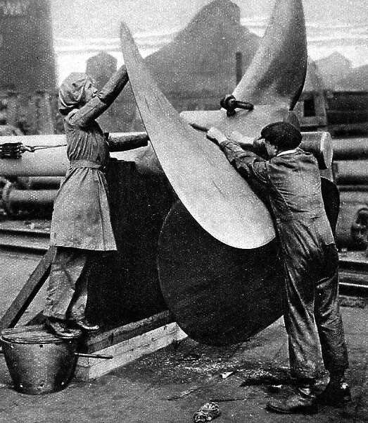 Polishing a war-ships propellor