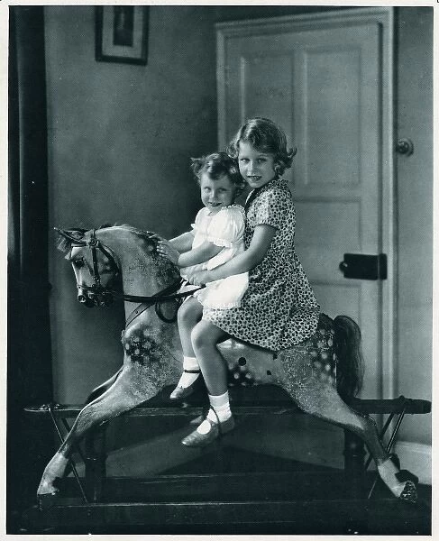 Princesses Elizabeth and Margaret on a rocking horse