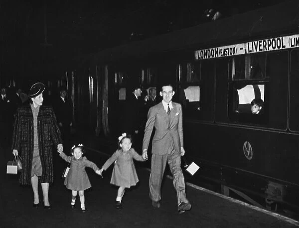 Refugee family at station WWII