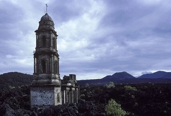 Paricutin volcano, Mexico - State of Michoacan Paricutin volcano is the cone visible in the distance. The lava flows buried the village, only the church tower and part of the facade were left standing