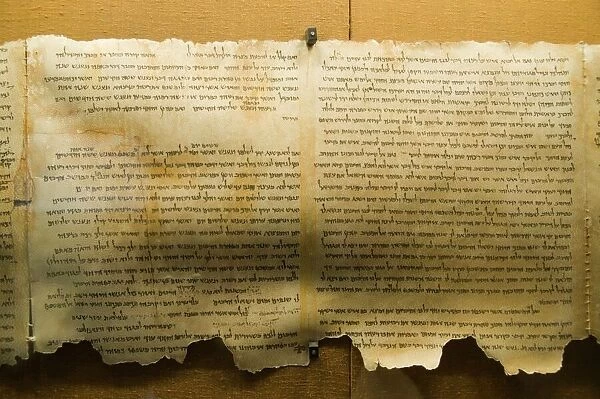 Dead Sea scroll. Fragment of the Dead Sea scrolls on display at the Qumran museum