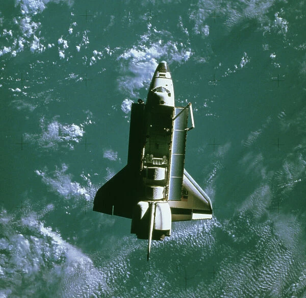 Space shuttle Challenger orbiting earth