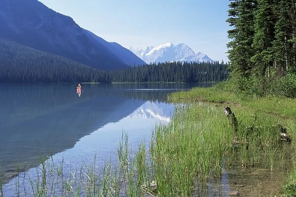Canoe on water, seen from the western shore of Emerald Lake, Yoho National Park