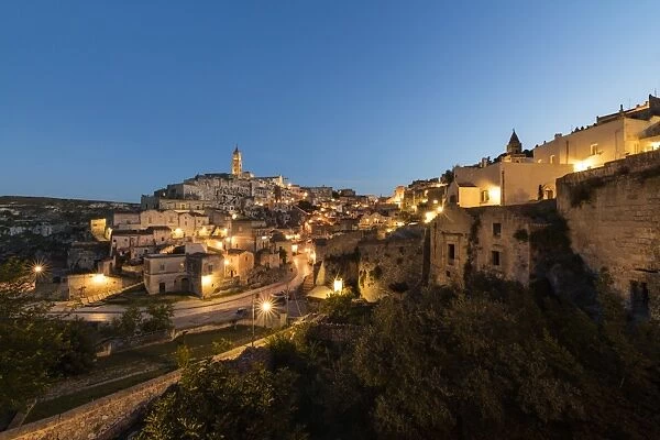 Dusk on the ancient town and historical center called Sassi, perched on rocks on top of hill