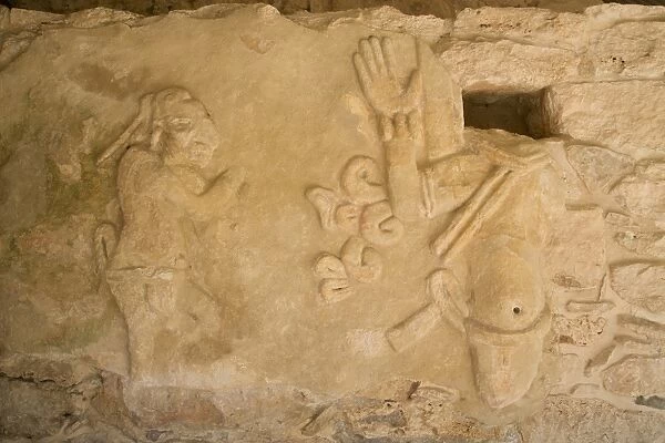 Figures of stucco relief, skeletal heads found in the niches, Castillo de Kukulcan
