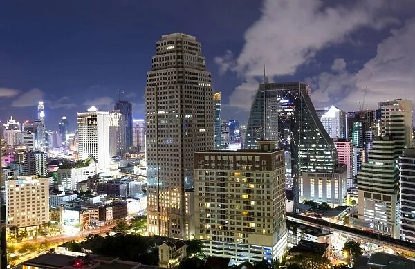 High rise buildings of Bangkok at night from Rembrandt Hotel and Towers, Sukhumvit 18, Bangkok, Thailand, Southeast Asia, Asia