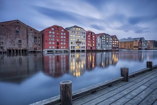 The lights of the houses reflected in the River Nidelva, Bakklandet, Trondheim, Norway