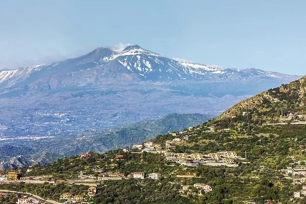 Looking from Taormina towards Trupiano and the smoking 3350m high volcano of Mount Etna during an active phase, Trupiano, Sicily, Italy, Mediterranean, Europe