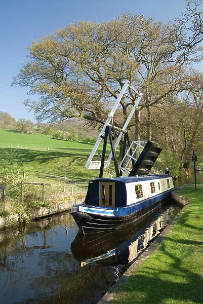 Narrow boat passing through a lift bridge, Llangollen Canal, Wales, United Kingdom