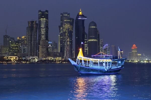 New skyline of the West Bay central financial district of Doha, illuminated at dusk, Qatar, Middle East