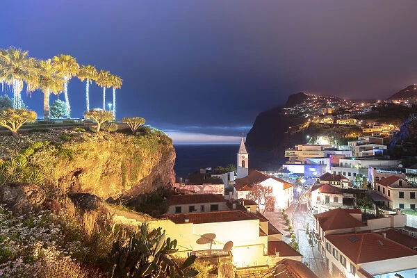 Old town of Camara de Lobos and cliffs at dusk, Madeira island, Portugal, Atlantic