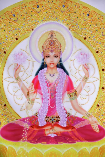 Picture of Lakshmi, goddess of wealth and consort of Lord Vishnu, sitting holding lotus flowers