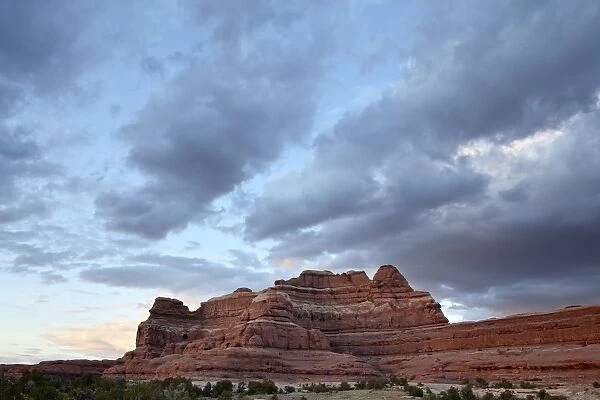 Red rock formation at sunset with clouds, The Needles District, Canyonlands National Park