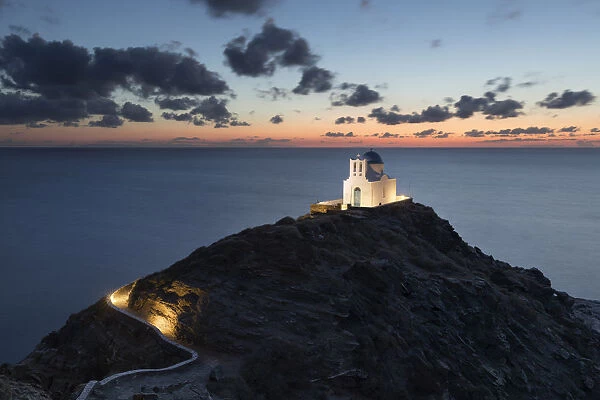 White Greek Orthodox chapel of Eftamartyres on headland at dawn, Kastro, Sifnos, Cyclades