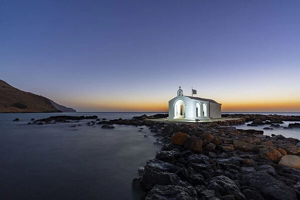 Whitewashed church of Agios Nikolaos at dusk, Georgioupolis, Crete island, Greek Islands, Greece, Europe