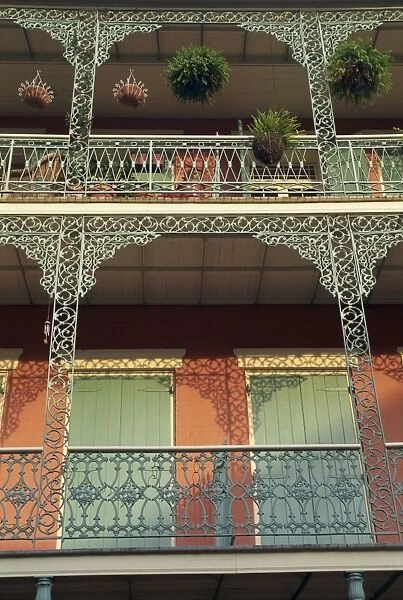 Detail of wrought iron and wooden shutters on balconies