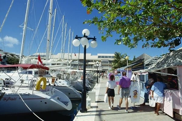 Yachts in the marina and small stalls selling to tourists