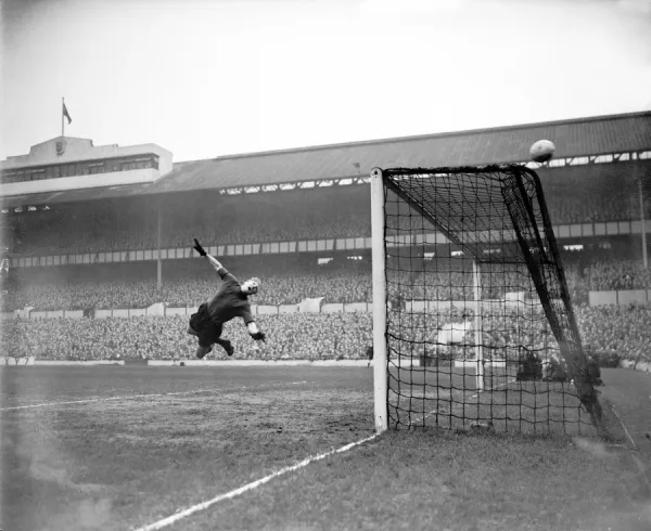 Bert Williams. Wolverhampton Wanderers goalkeeper Bert Williams dives in
