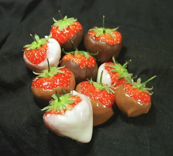 Dipped strawberries. For commercial use please contact Photoslot at