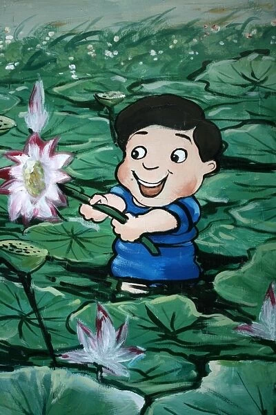 Taiwanese boy in lily pond