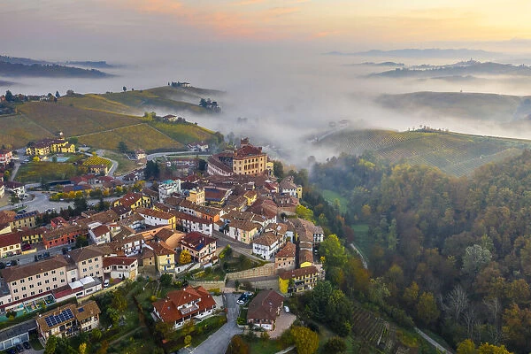 Aerial view of Falletti Castle and Barolo at sunrise during autumn, Cuneo, Langhe e Roero