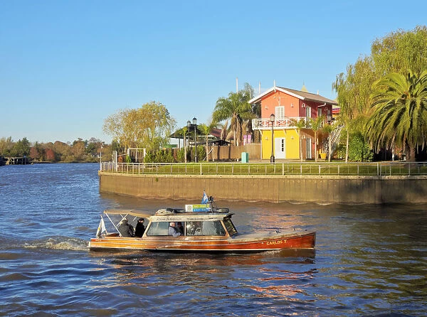 Argentina, Buenos Aires Province, Tigre, Vintage mahogany motorboat on the Tigre River