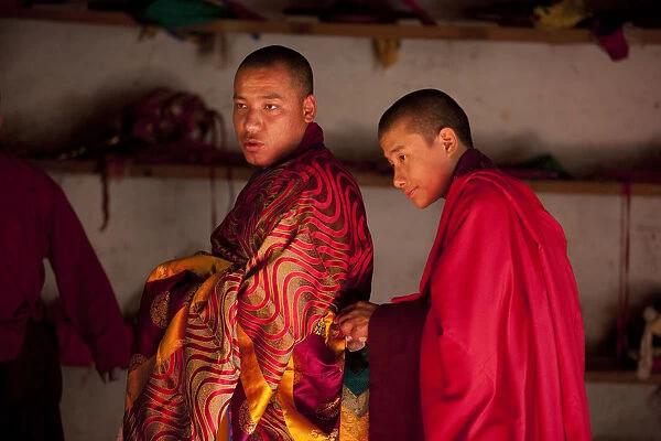 Bhutan. Participants at the tsechu in Wangdue Phodrang getting ready for a performance