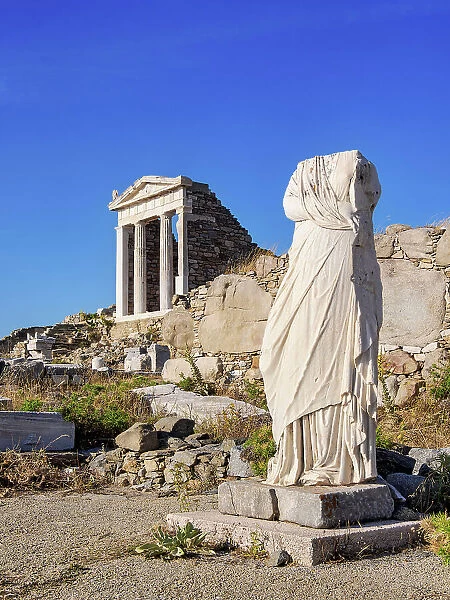 Headless Statue and the Temple of Isis, Delos Archaeological Site, Delos Island, Cyclades, Greece