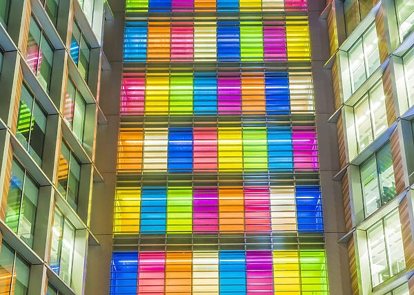 Illuminated colourful office windows, London, England, UK