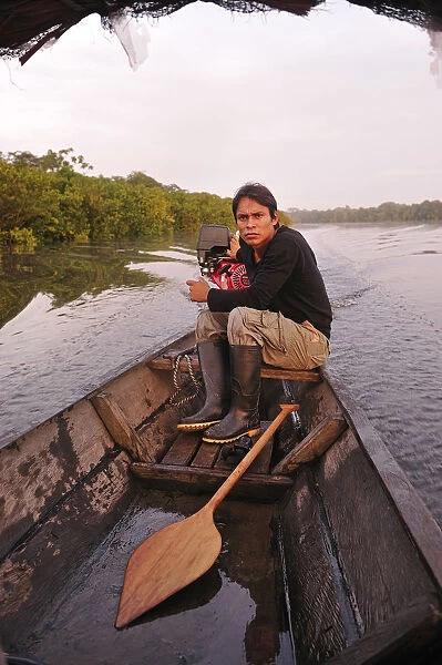 man in dugout canoe on the lago de tarapoto, amazon river