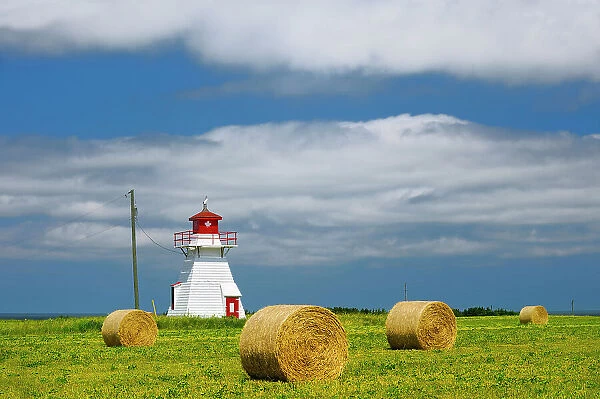 Lighthouse and bales Darnley Prince Edward Island Canada