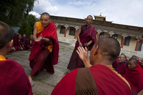 Monks debating at the Sangha of the Kharchu Monastery in Chamkar, Bhutan