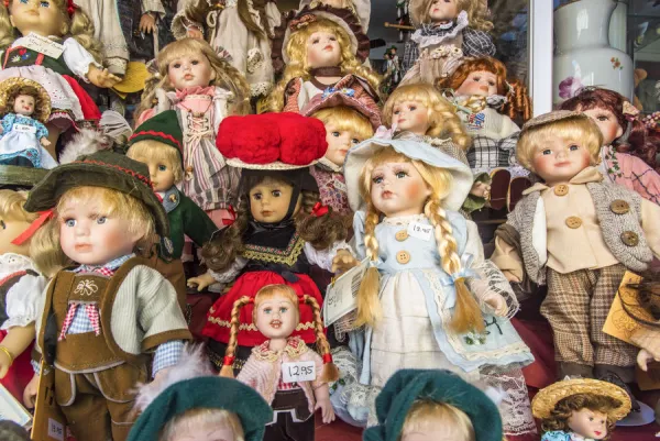 Porcelain dolls on display in a shop window For sale as Framed