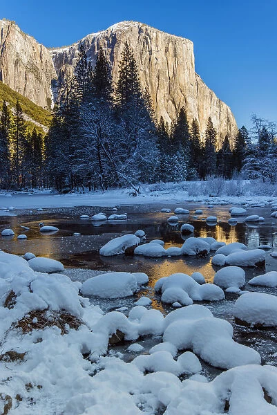 Winter landscape with iced river and El Capitan mountain behind, Yosemite National Park