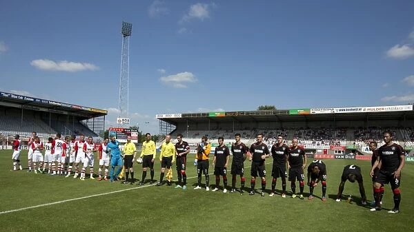 Rangers and FC Emmen Players Align Before Kick-Off at Meerdjik Stadium: Rangers Lead 1-0 in Pre-Season Friendly
